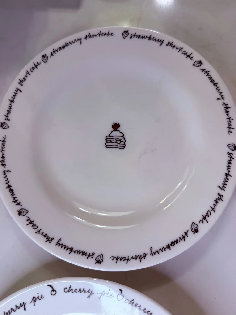 Pottery Barn porcelain Dessert Plates – White with Black Script and Cake Motifs